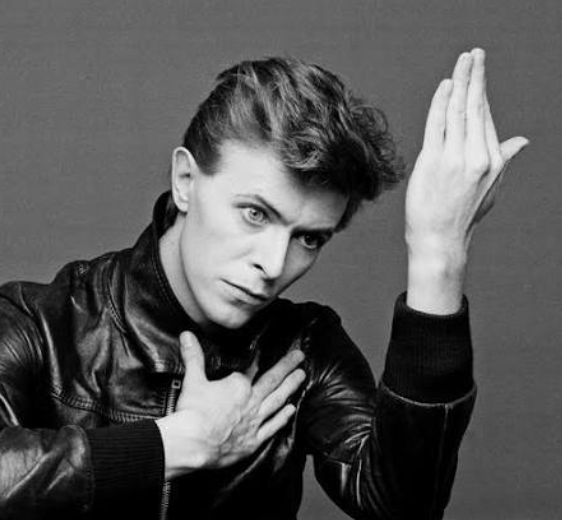 Black-and-white portrait of David Bowie in a leather jacket
