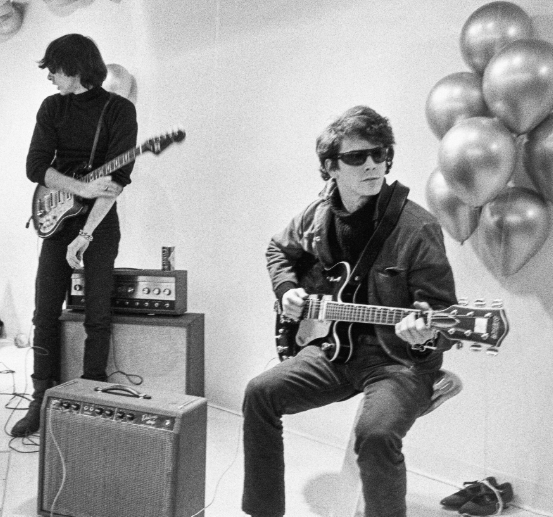 Lou Reed and Sterling Morrison playing electric guitars in Andy Warhol's silver Factory